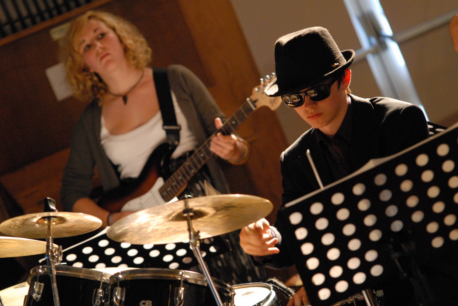 Bassist and drummer wearing sunglasses